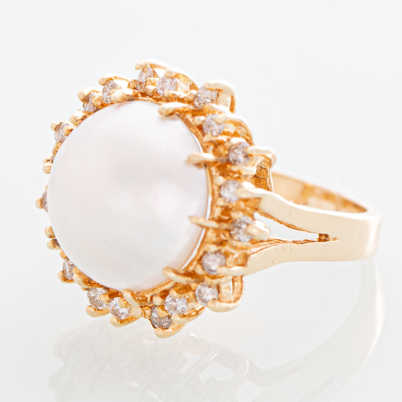 Helios Mabe pearl and diamond ring in 14k gold.