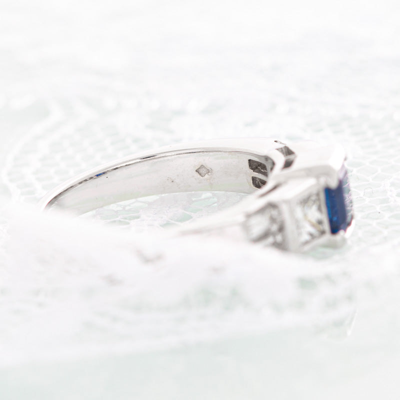 Geometric blue sapphire ring with diamonds in 14k white gold.