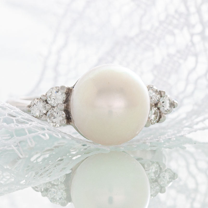 White pearl ring with diamonds in 14k white gold.