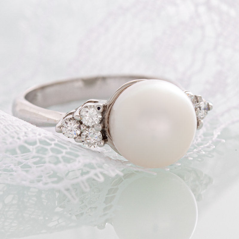 White pearl ring with diamonds in 14k white gold.