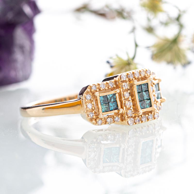 Triple geometric enhanced blue diamond halo ring with diamonds in 14k yellow gold.