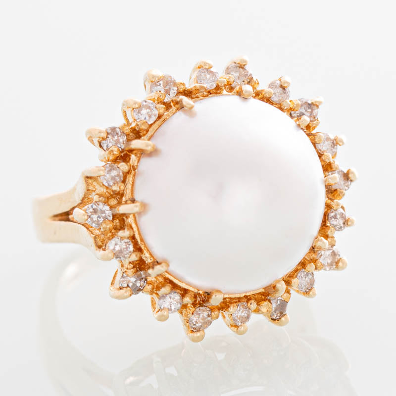 Helios Mabe pearl and diamond ring in 14k gold.