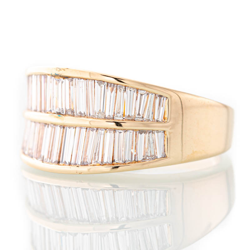 Story Baguette diamond ring in 14k gold.